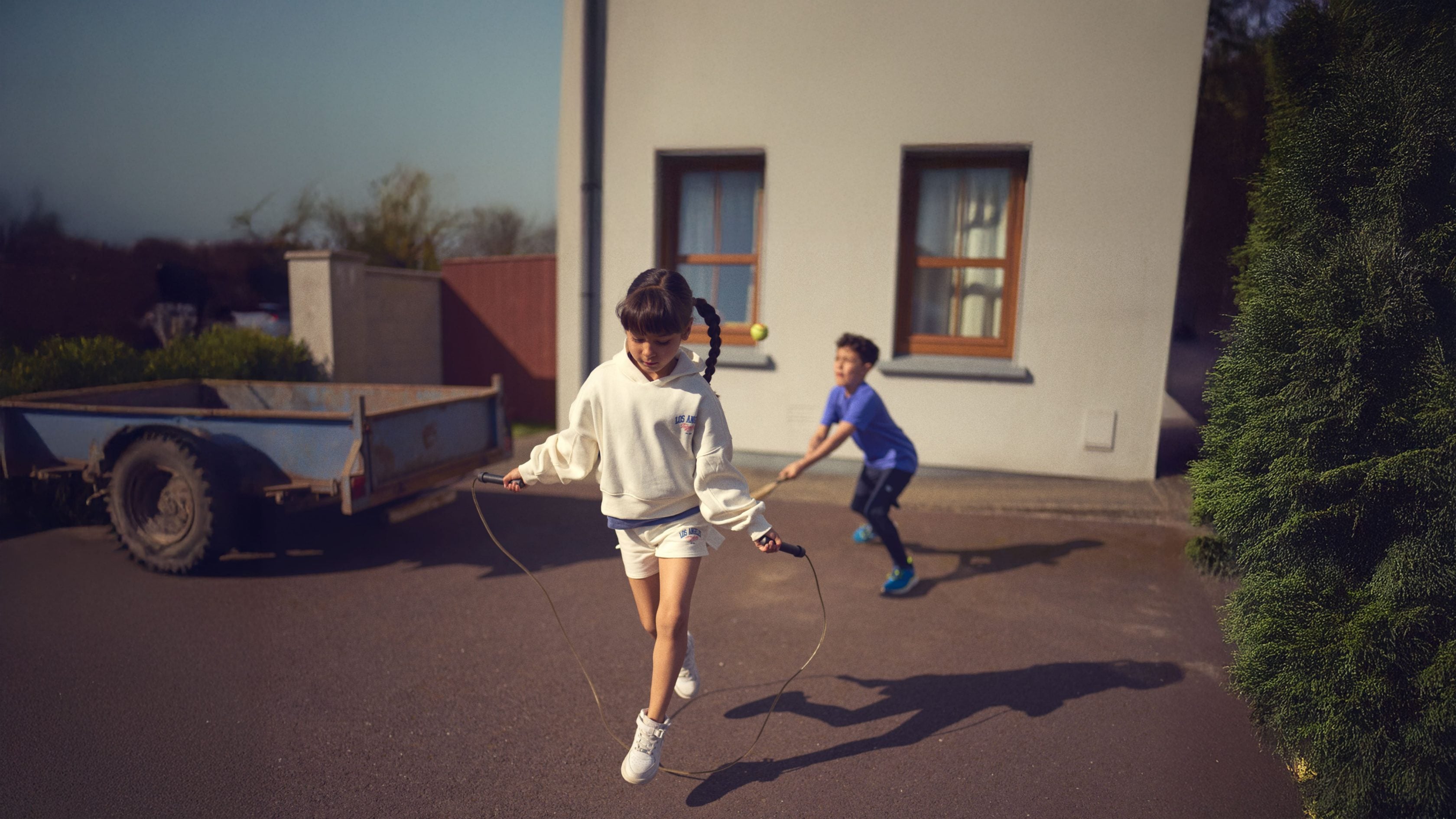 Children playing outside house